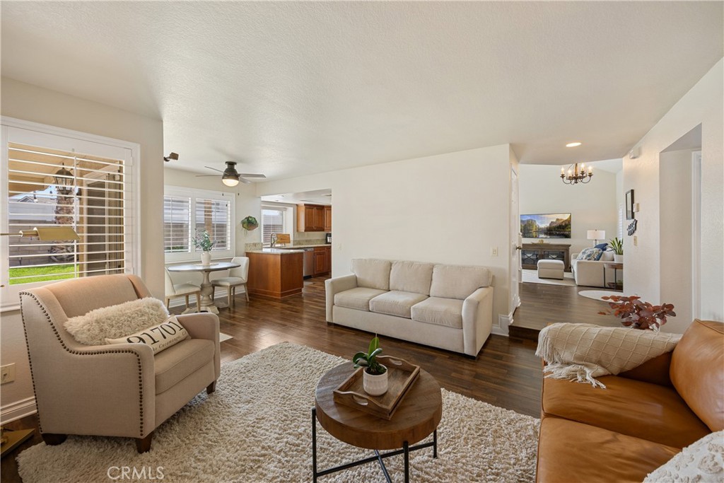 7051 Stanislaus Place Rancho Cucamonga, CA 91701 - Photo 14 of 57 a living room with furniture and a large window