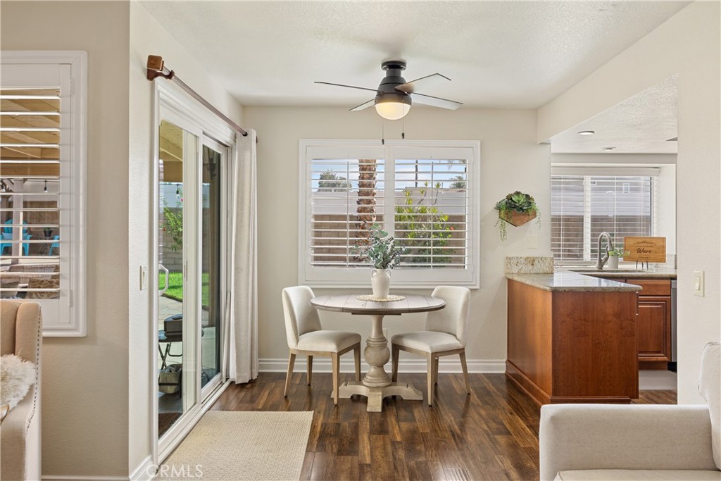 7051 Stanislaus Place Rancho Cucamonga, CA 91701 - Photo 19 of 57 a view of a dining room with furniture window and wooden floor