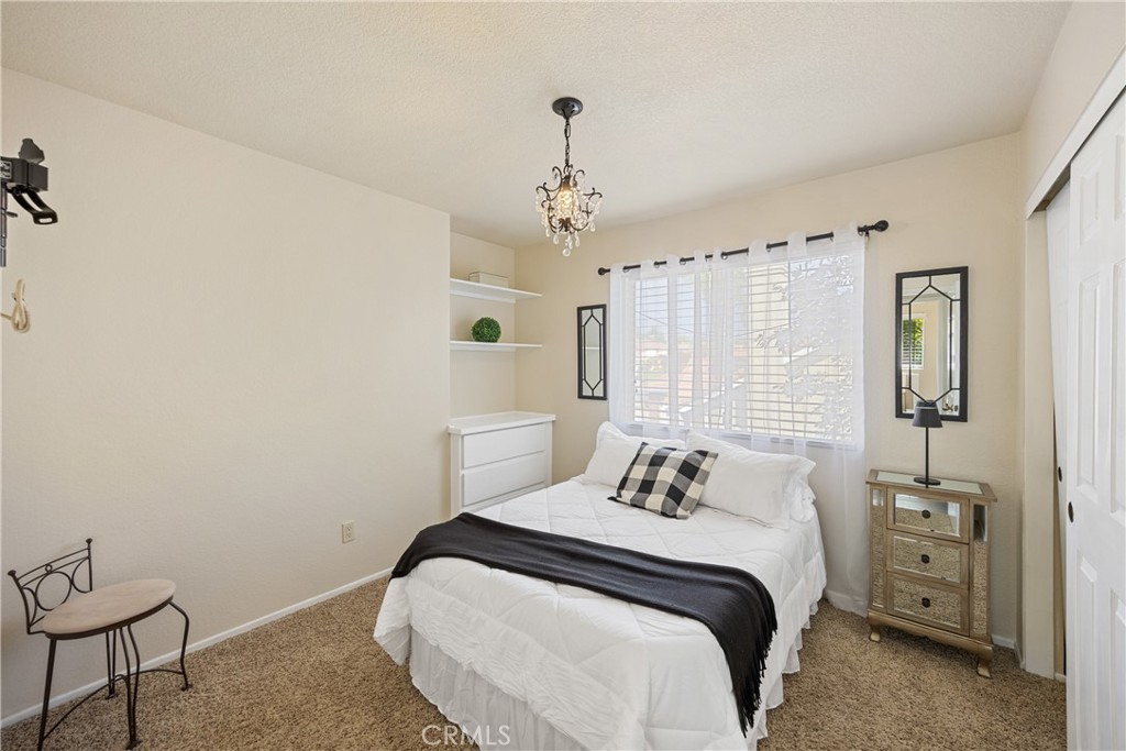 7051 Stanislaus Place Rancho Cucamonga, CA 91701 - Photo 28 of 57 a bedroom with a bed and a window