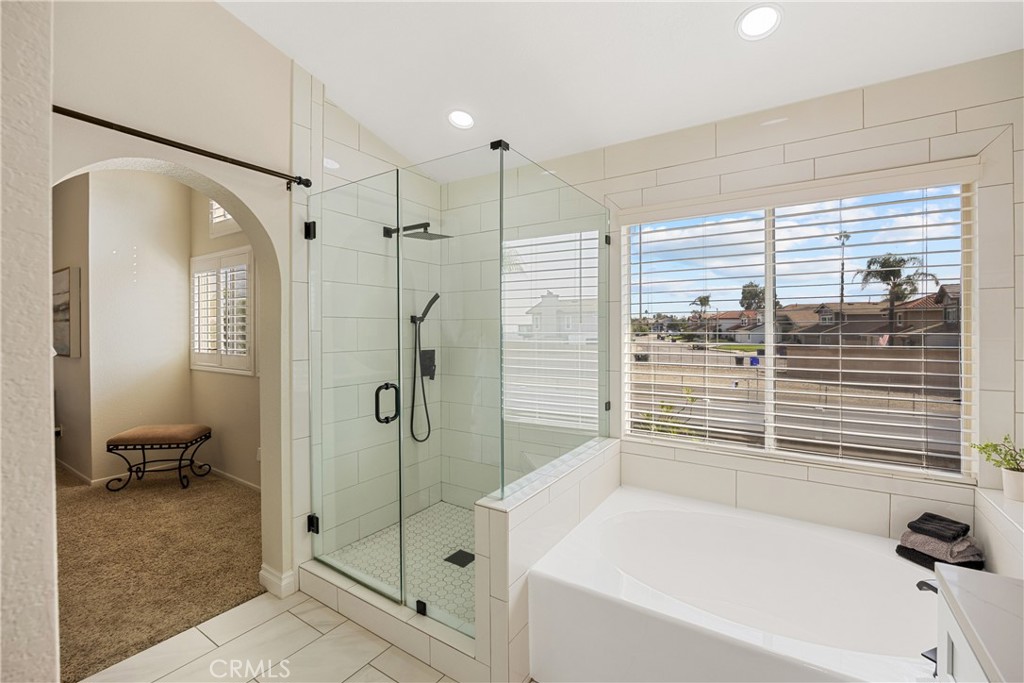 7051 Stanislaus Place Rancho Cucamonga, CA 91701 - Photo 35 of 57 a bathroom with a tub and a shower