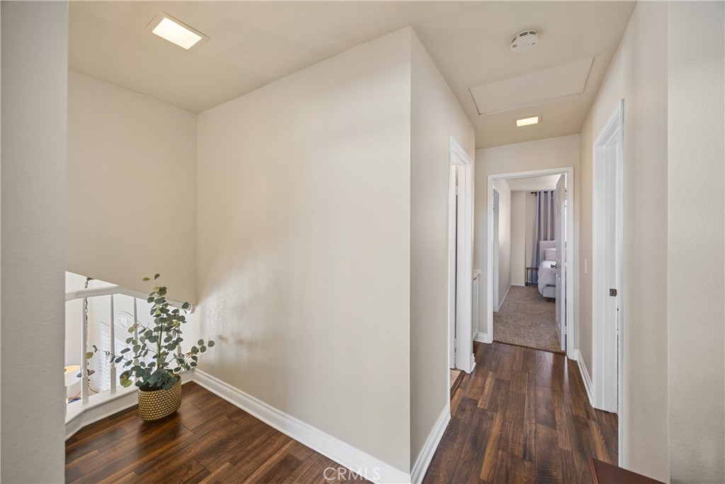 7051 Stanislaus Place Rancho Cucamonga, CA 91701 - Photo 38 of 57 a view of a hallway with wooden floor and staircase