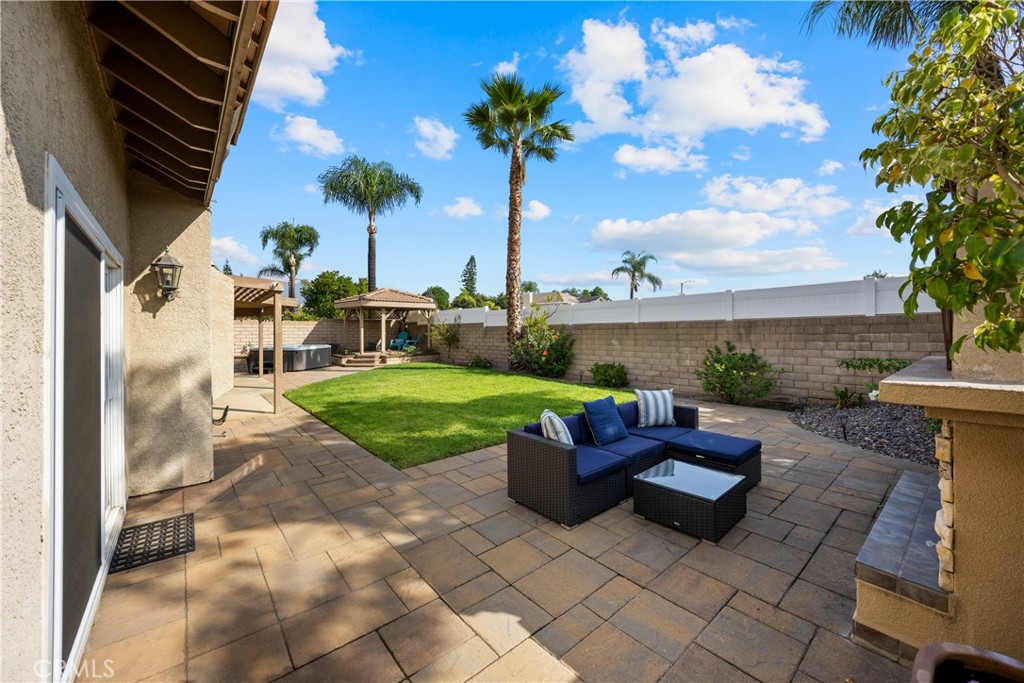 7051 Stanislaus Place Rancho Cucamonga, CA 91701 - Photo 39 of 57 a view of a patio with couches table and chairs and potted plants
