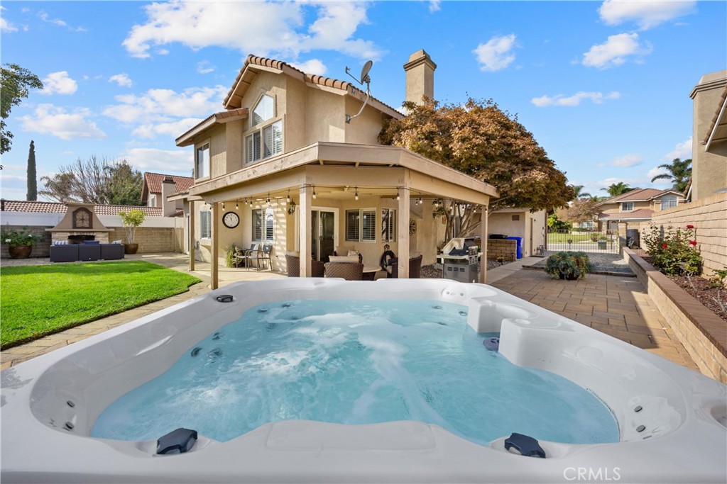 7051 Stanislaus Place Rancho Cucamonga, CA 91701 - Photo 45 of 57 a view of a white house with a swimming pool