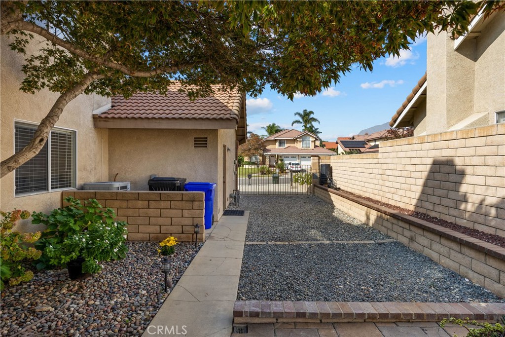 7051 Stanislaus Place Rancho Cucamonga, CA 91701 - Photo 47 of 57 a front view of a house with a yard