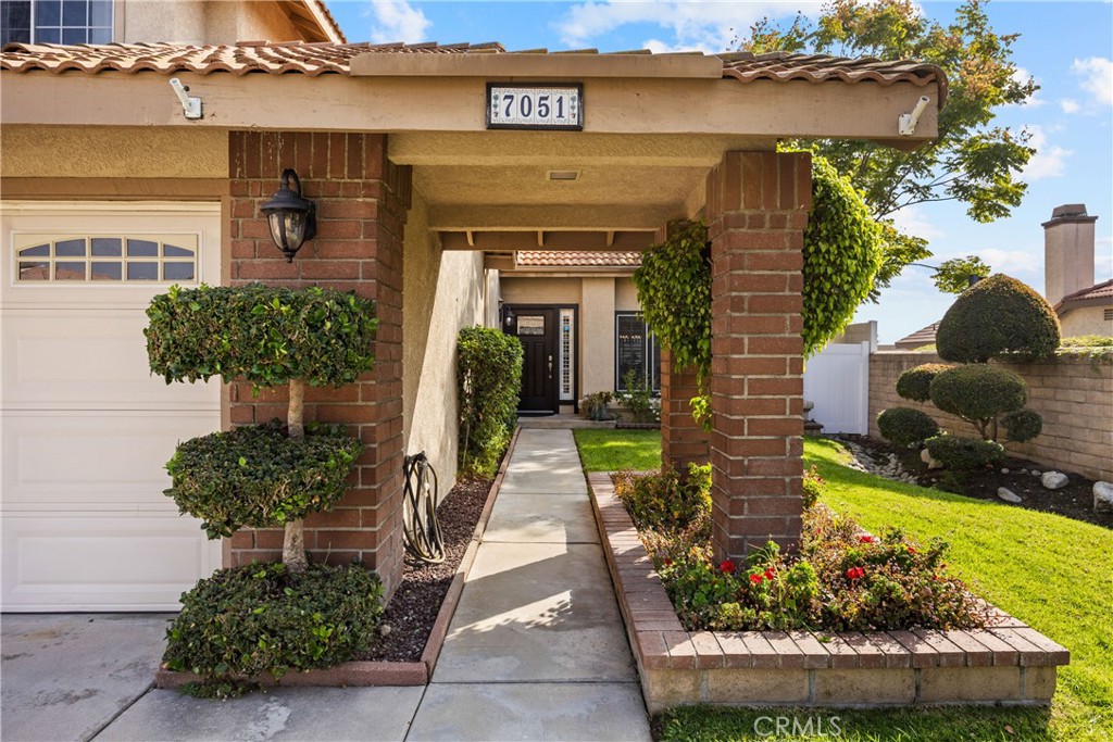 7051 Stanislaus Place Rancho Cucamonga, CA 91701 - Photo 5 of 57 a front view of a house with a yard