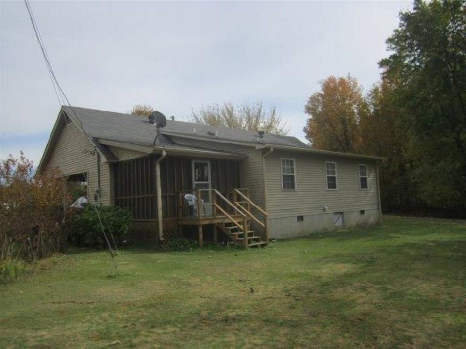 1741 Conner Whitefield Road Ripley, TN 38063 - Photo 6 of 24 a house view with a garden space