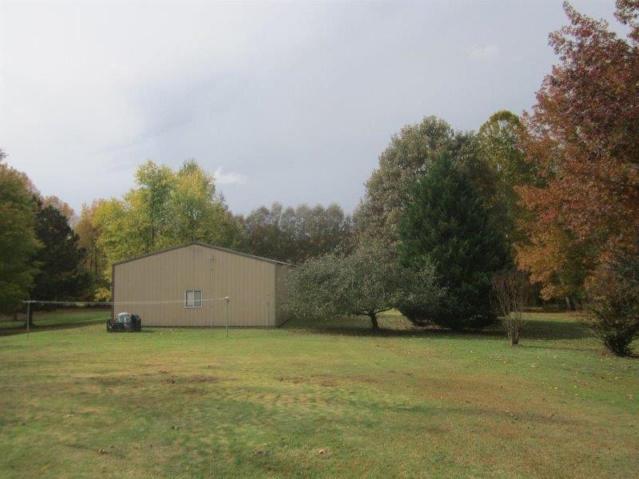 1741 Conner Whitefield Road Ripley, TN 38063 - Photo 10 of 24 a view of a barn in the middle of a field