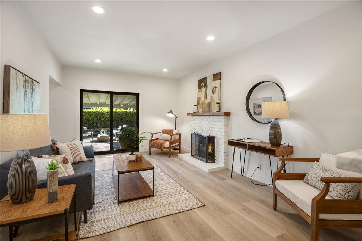 1069 Malott Drive San Jose, CA 95121 - Photo 11 of 32 a living room with furniture and a fireplace