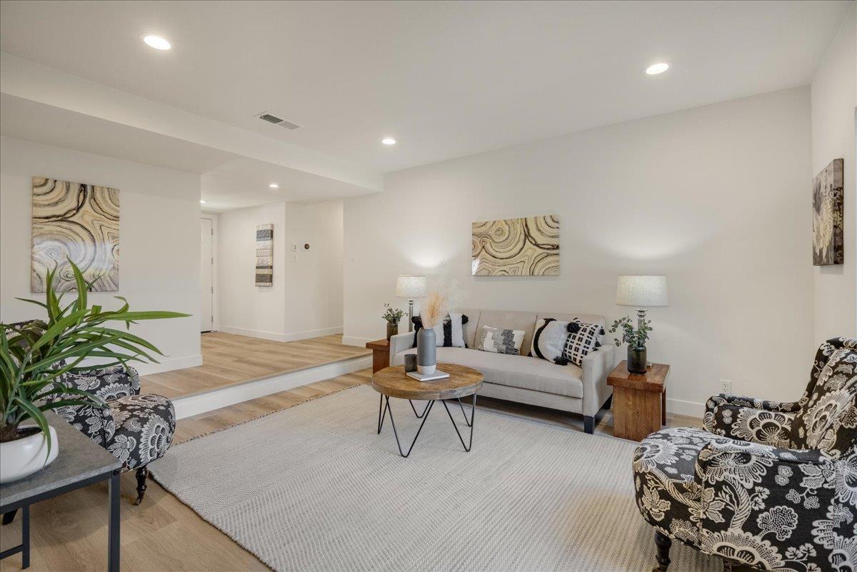 1069 Malott Drive San Jose, CA 95121 - Photo 16 of 32 a living room with furniture and flowers