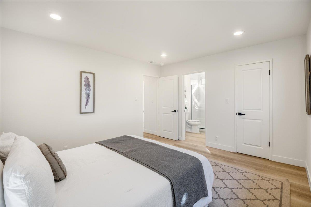 1069 Malott Drive San Jose, CA 95121 - Photo 19 of 32 a bedroom with a bed and a cabinets