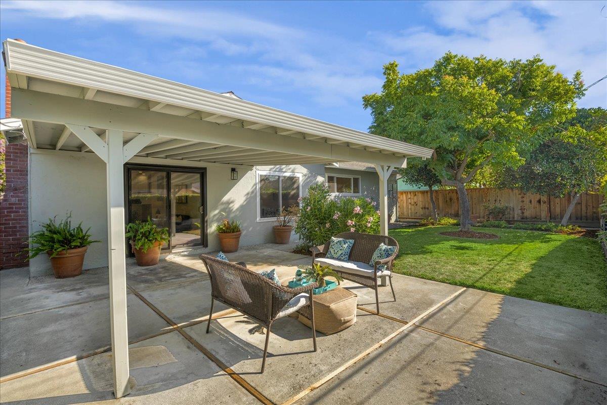 1069 Malott Drive San Jose, CA 95121 - Photo 32 of 32 a view of a house with backyard sitting area and garden
