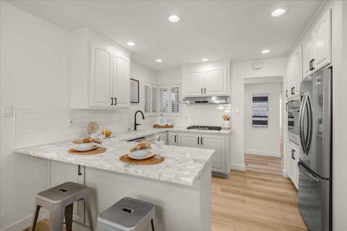 1069 Malott Drive San Jose, CA 95121 - Photo 5 of 32 a kitchen with a sink stove and refrigerator