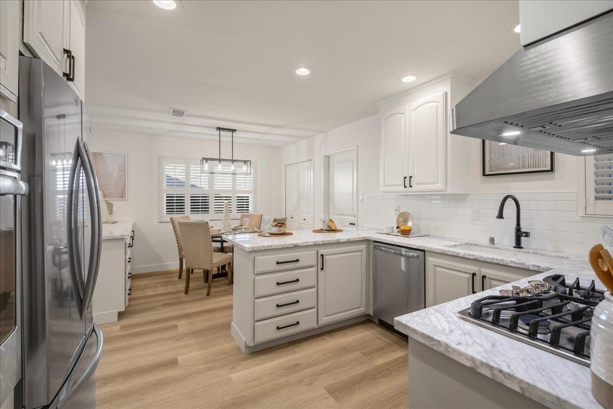 1069 Malott Drive San Jose, CA 95121 - Photo 8 of 32 a kitchen with granite countertop a sink stove and refrigerator