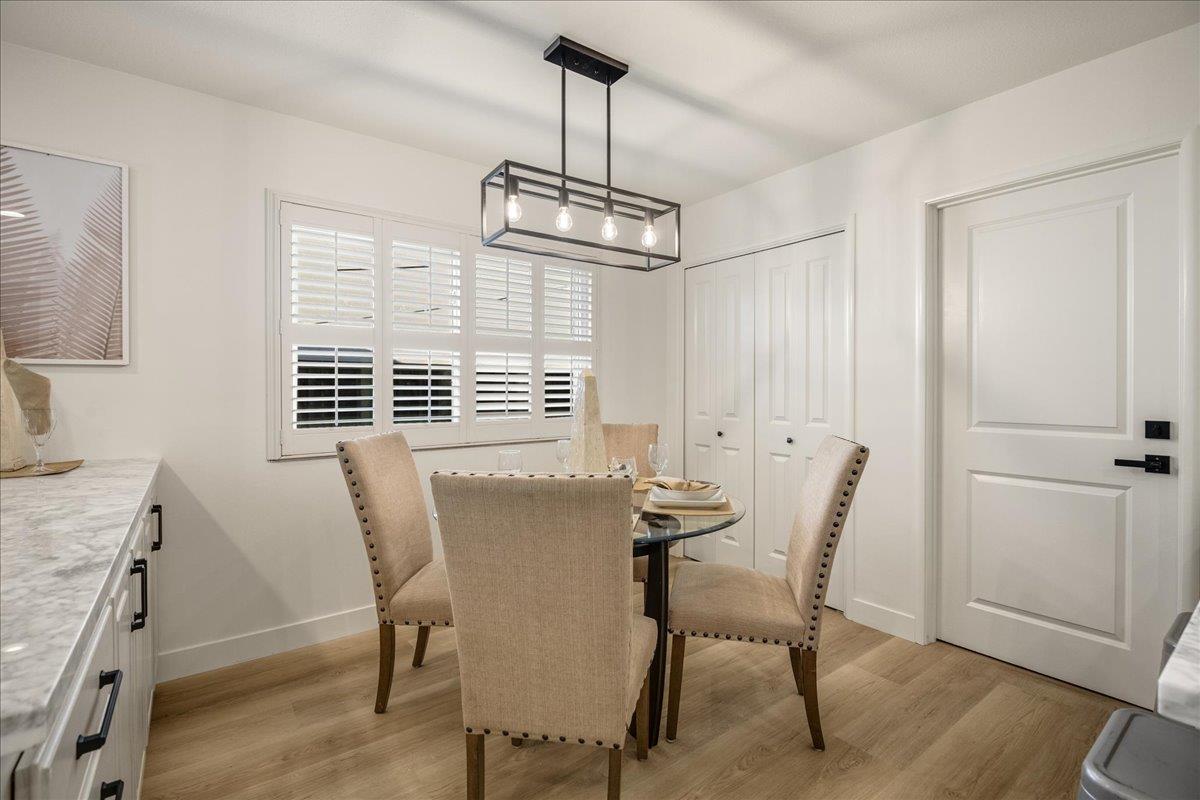 1069 Malott Drive San Jose, CA 95121 - Photo 9 of 32 a view of a dining room with furniture window and wooden floor