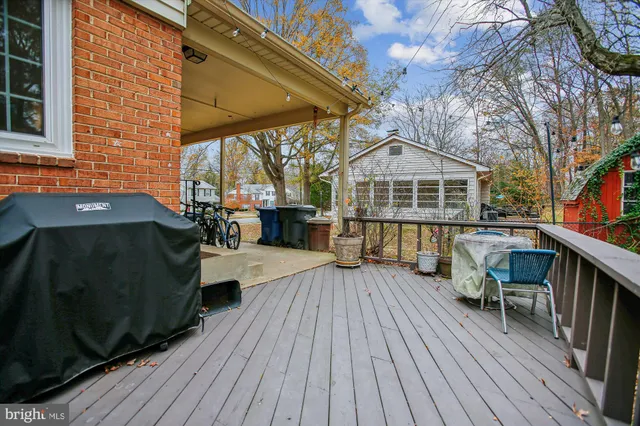 a living room with furniture a fireplace and wooden floor