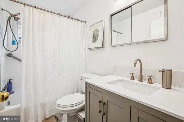 a group of people sitting in front of a building