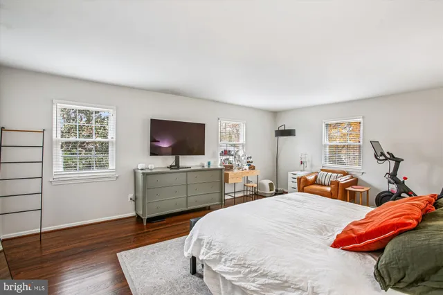 a view of a cafe with a table and chairs under an umbrella