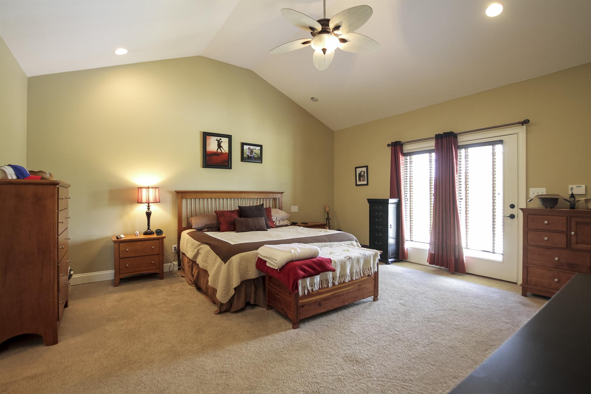 4599 Gamble Road Cedar Hill, TN 37032 - Photo 12 of 25 a spacious bedroom with a bed and a chandelier