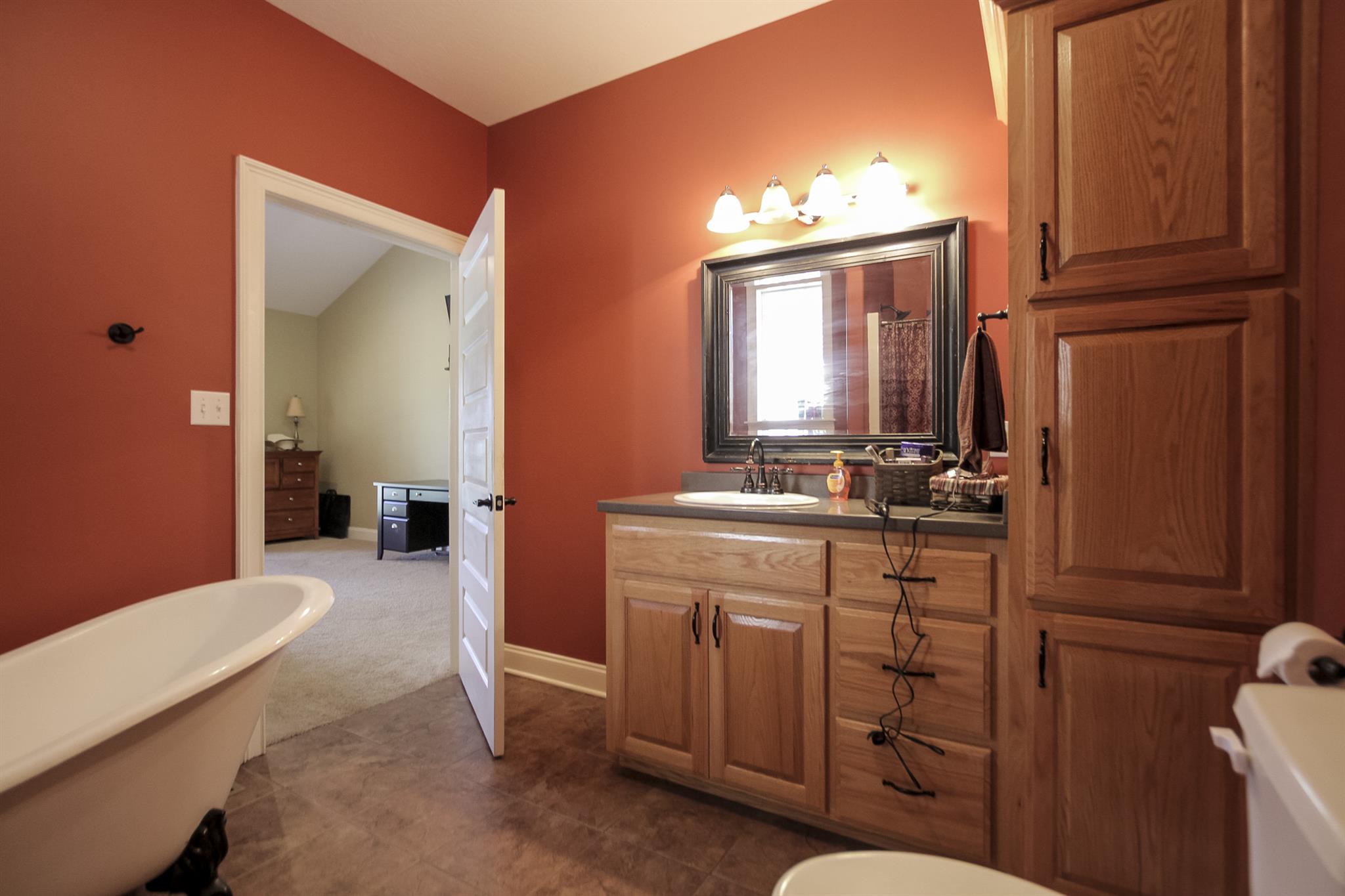 4599 Gamble Road Cedar Hill, TN 37032 - Photo 15 of 25 a bathroom with a sink a toilet and mirror