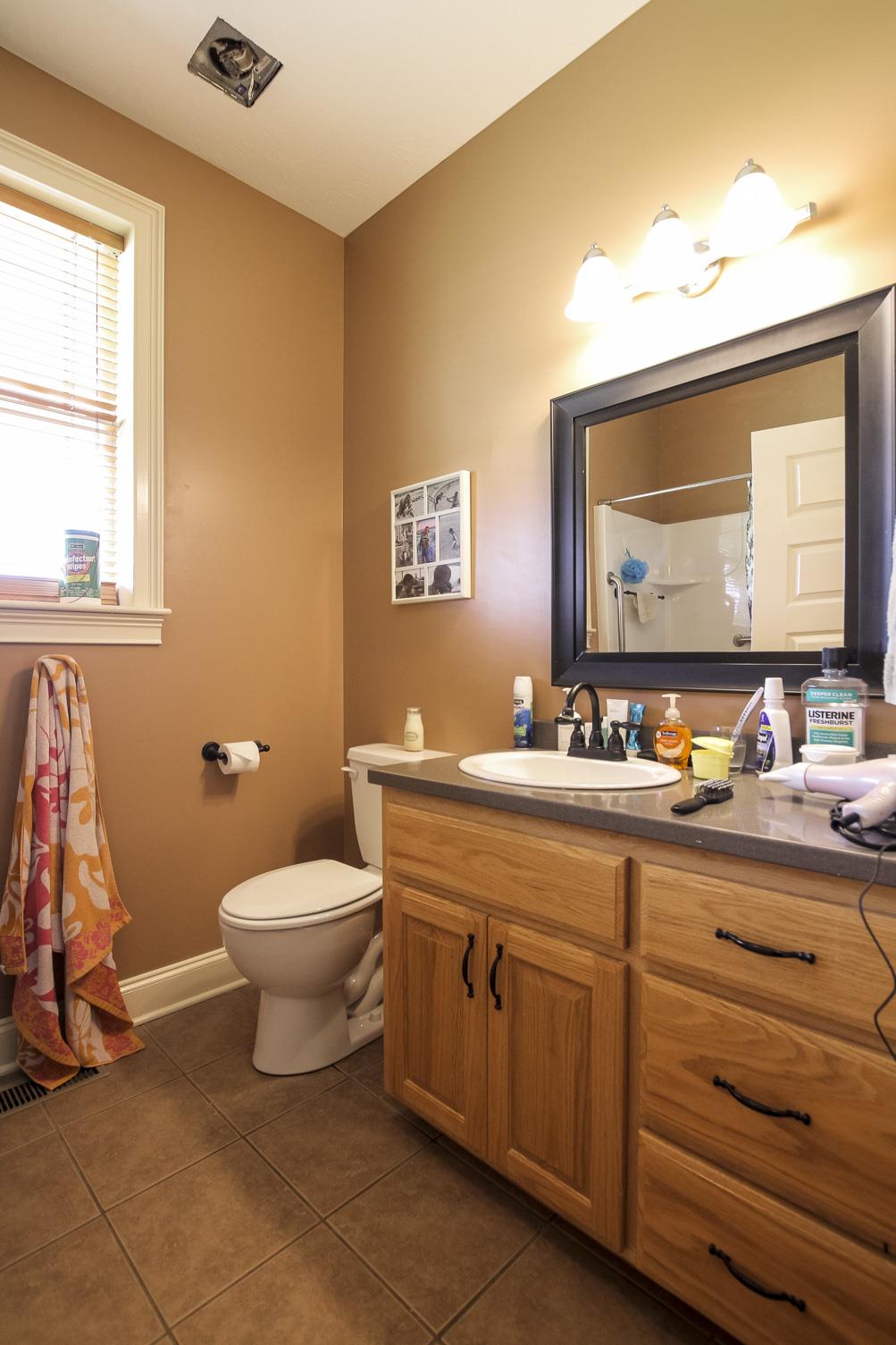 4599 Gamble Road Cedar Hill, TN 37032 - Photo 17 of 25 a bathroom with a toilet sink and mirror
