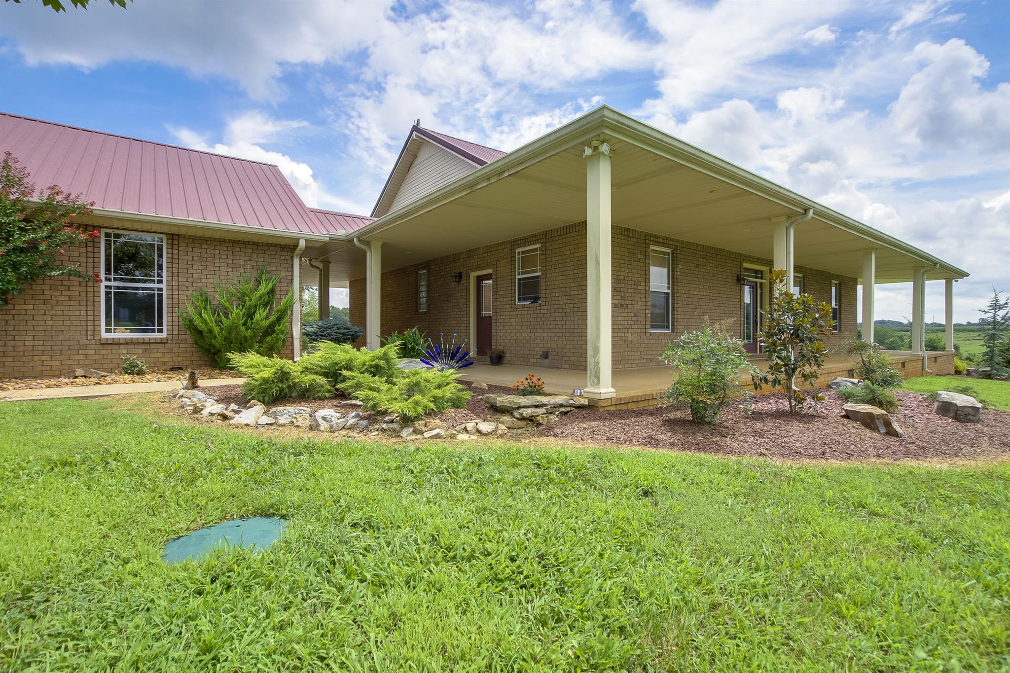 4599 Gamble Road Cedar Hill, TN 37032 - Photo 3 of 25 a front view of a house with yard and green space