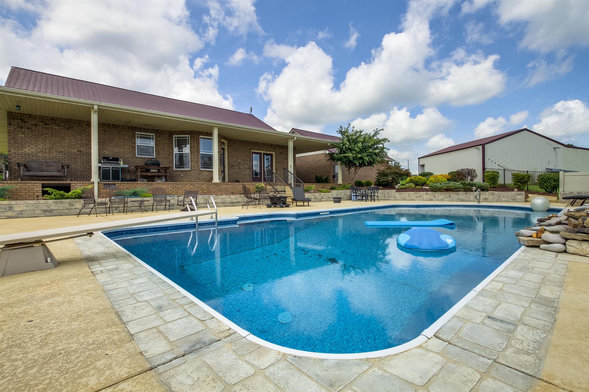 4599 Gamble Road Cedar Hill, TN 37032 - Photo 25 of 25 a swimming pool with outdoor seating