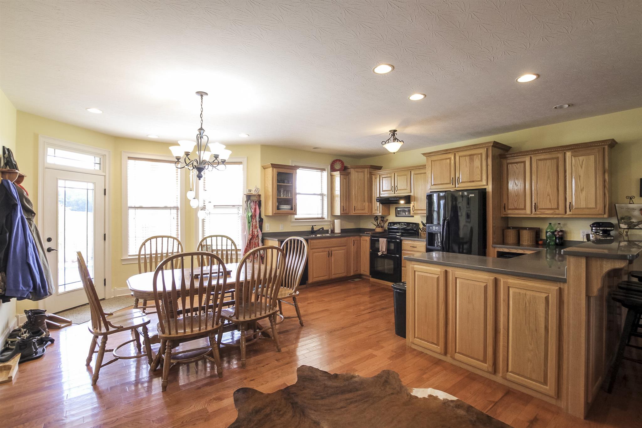 4599 Gamble Road Cedar Hill, TN 37032 - Photo 9 of 25 a view of a dining room with furniture window and wooden floor