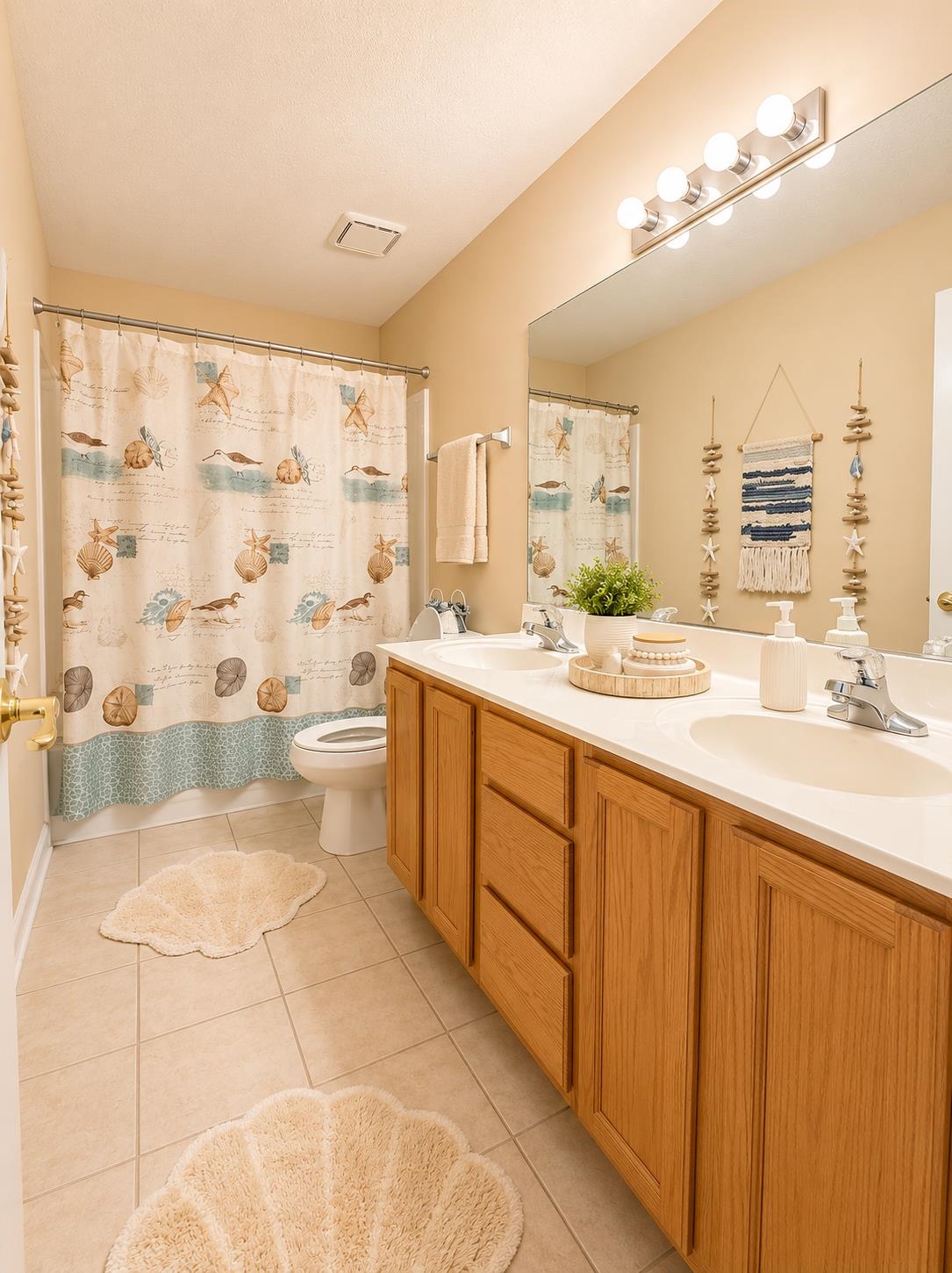 326 South Sanga Road Cordova, TN 38018 - Photo 23 of 32 Dual vanity with wood-finish cabinetry, integrated sinks, and a single large mirror