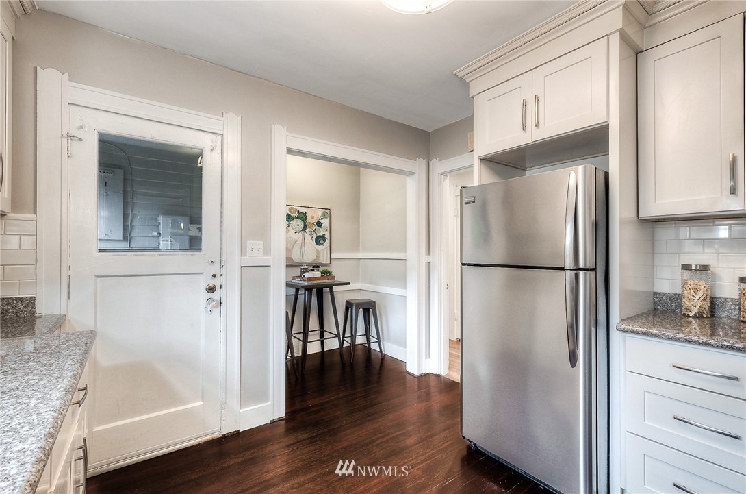 452 North 65th Street Seattle, WA 98103 - Photo 18 of 31 a kitchen with a refrigerator a sink and dishwasher