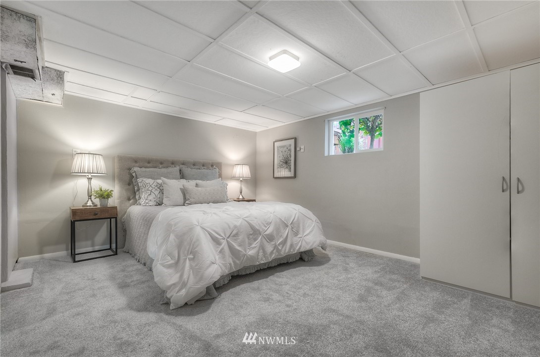 452 North 65th Street Seattle, WA 98103 - Photo 24 of 31 a bedroom with a bed and a night stand