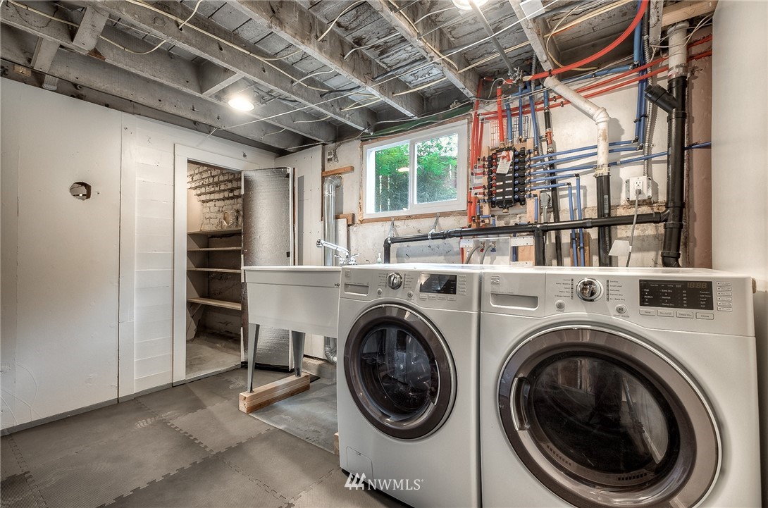 452 North 65th Street Seattle, WA 98103 - Photo 26 of 31 a utility room with dryer and washer