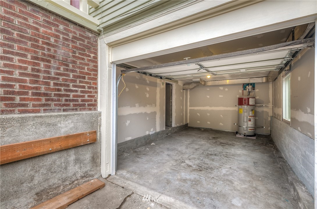 452 North 65th Street Seattle, WA 98103 - Photo 30 of 31 a view of a hallway with wooden floor and staircase