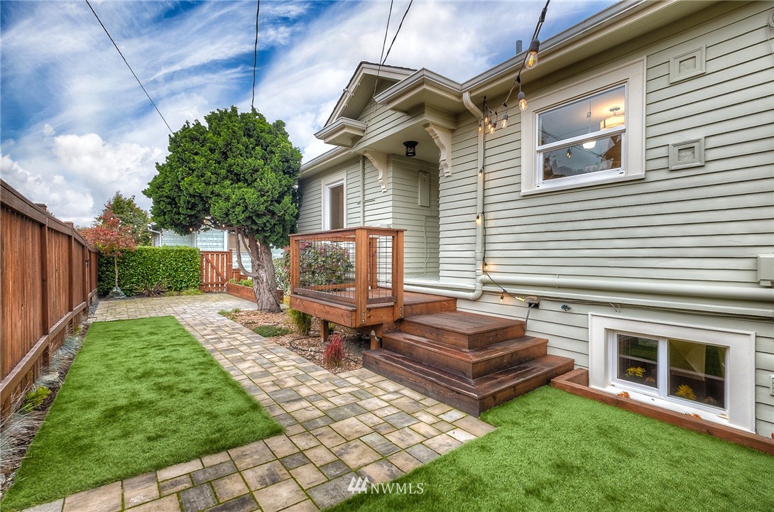 452 North 65th Street Seattle, WA 98103 - Photo 4 of 31 a view of a backyard with chairs and a fire pit