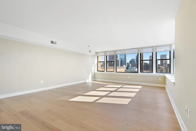 a view of an empty room with a window