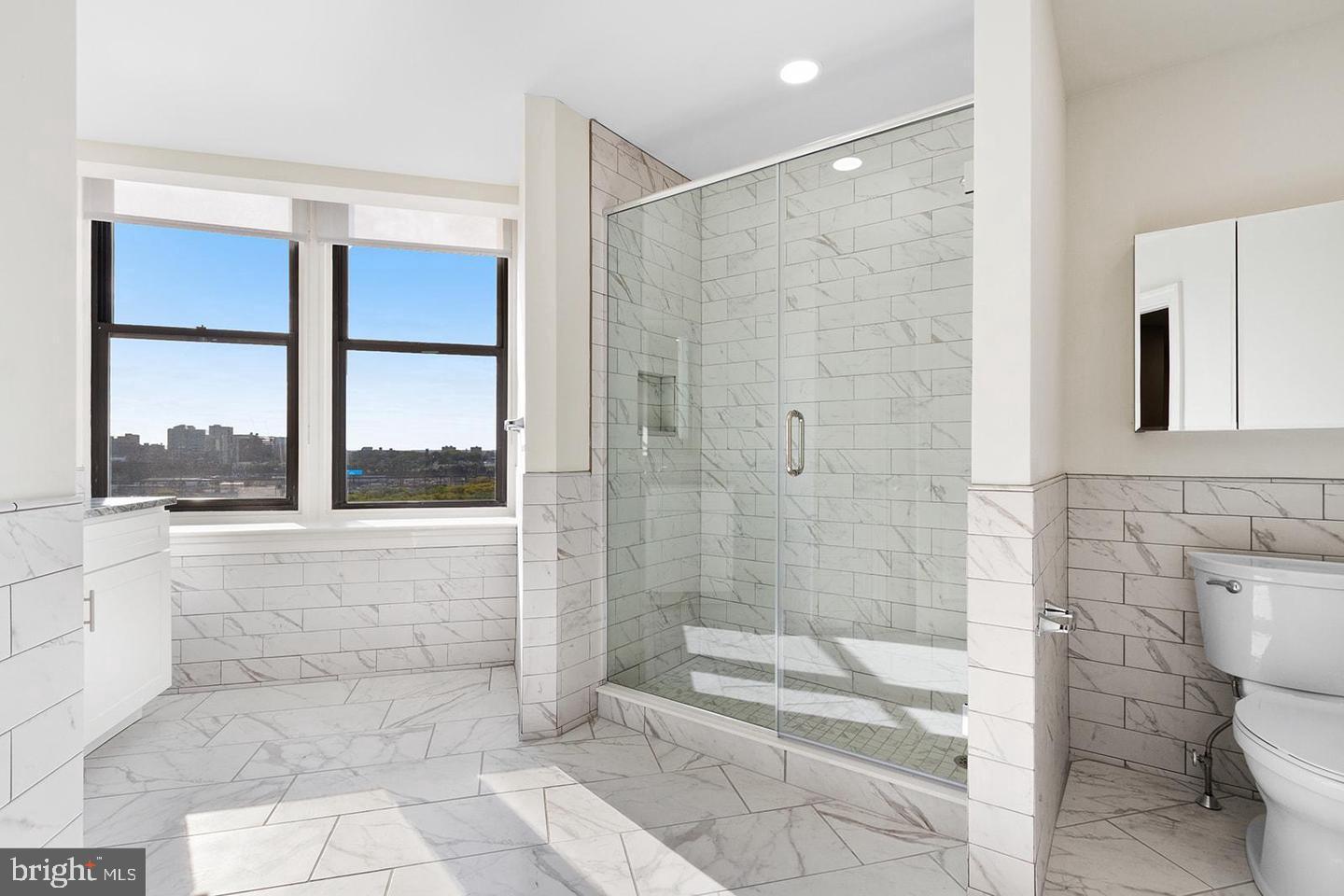 2201 Pennsylvania Avenue, Unit 1204B Philadelphia, PA 19130 - Photo 2 of 46 a bathroom with a shower and a toilet