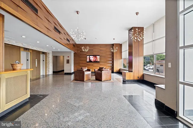 a view of a living room and entry way
