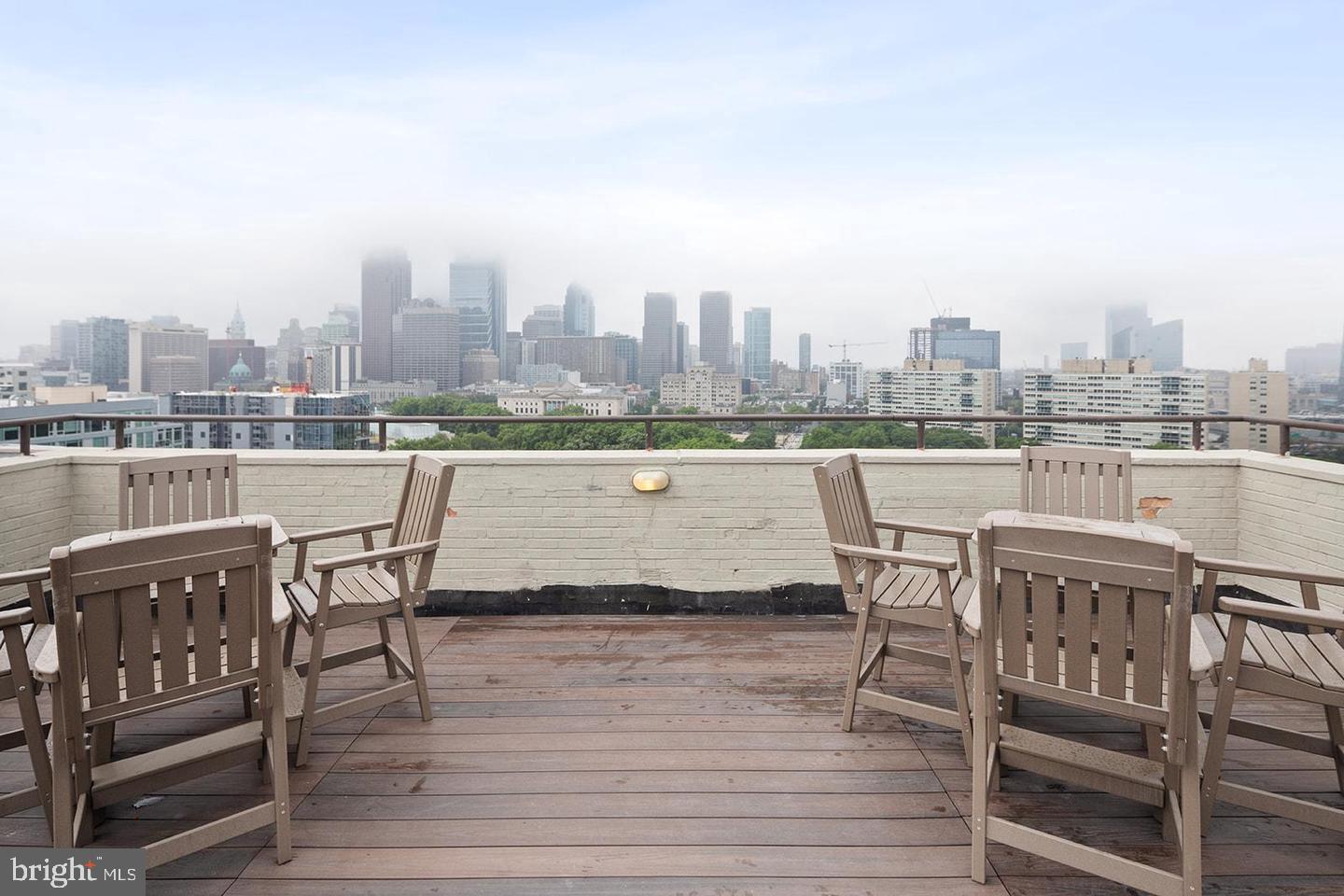 2201 Pennsylvania Avenue, Unit 1204B Philadelphia, PA 19130 - Photo 32 of 46 a view of a terrace with wooden benches