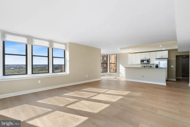 a view of an empty room with a window