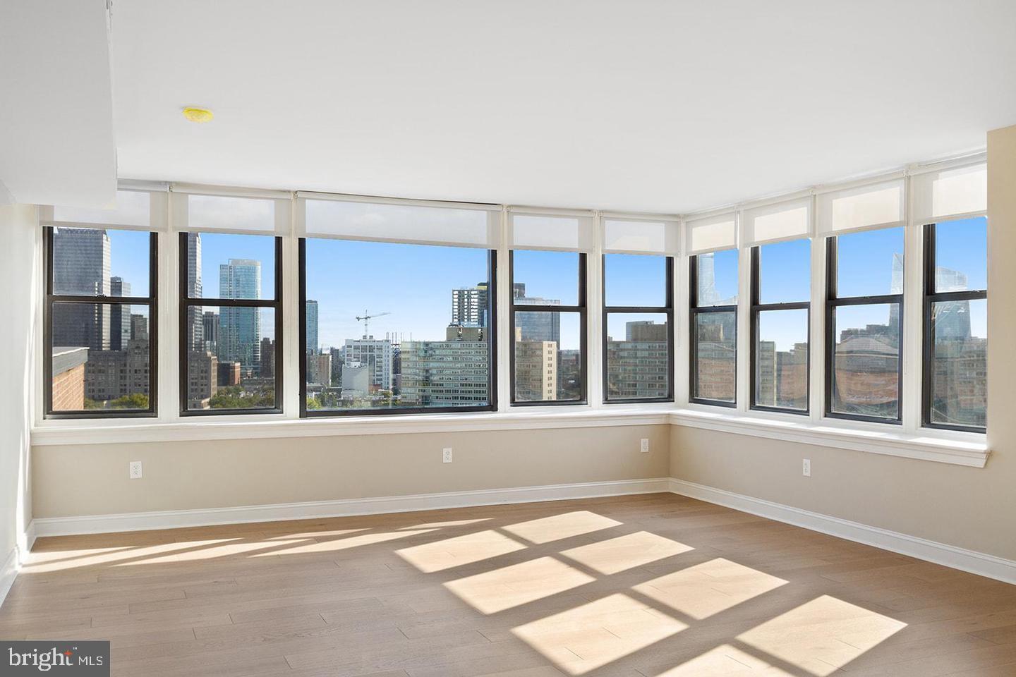 2201 Pennsylvania Avenue, Unit 1204B Philadelphia, PA 19130 - Photo 10 of 46 an empty room with a window