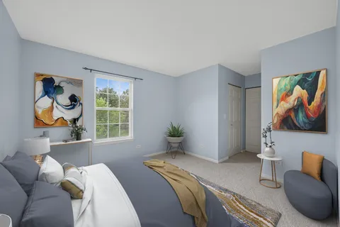 a bedroom with a bed and a painting on the wall