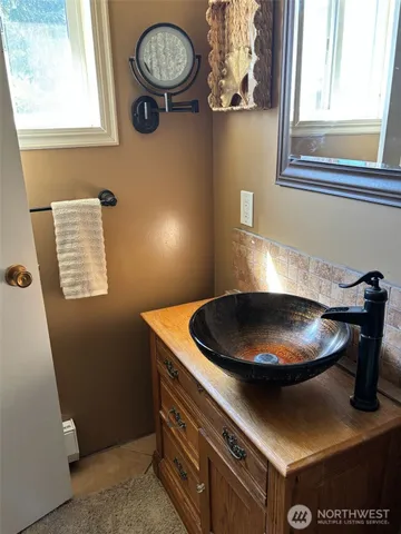 a view of a kitchen with a stove and a window