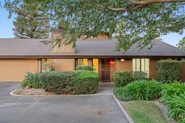 an aerial view of a house with large garden