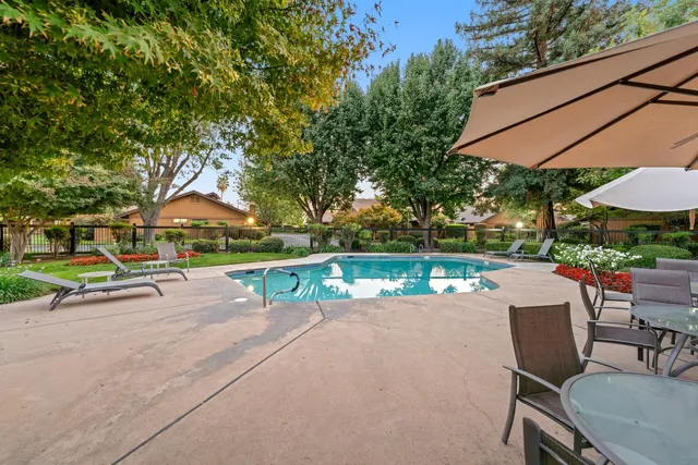 an outdoor space with furniture and umbrella