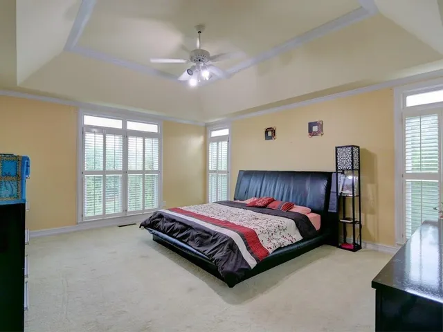 a bedroom with a bed and window