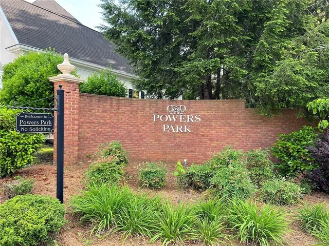 a view of a tree in front of a house