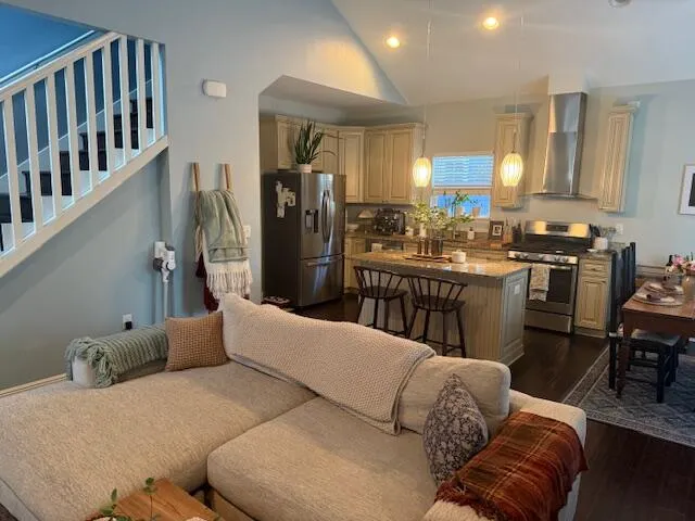 a living room with furniture fireplace and cabinets