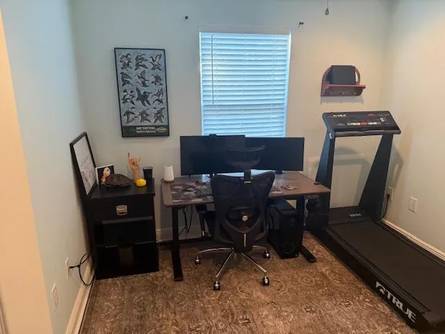 a view of a workspace with furniture