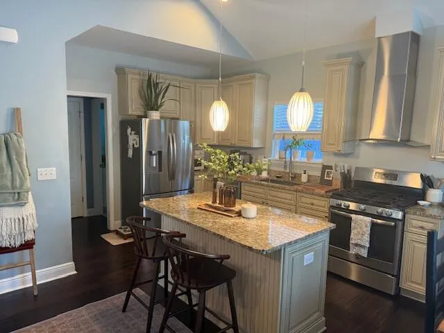 a kitchen with a sink cabinets and wooden floor
