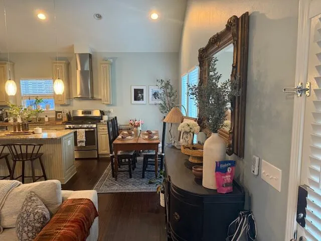 a living room with furniture and a kitchen