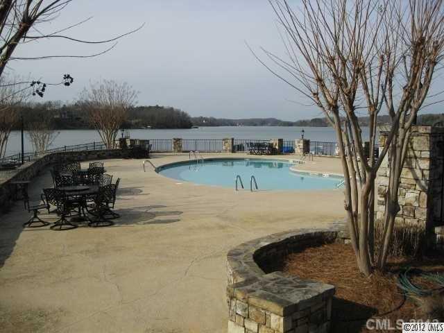 22 Windemere Isle Road Statesville, NC 28677 - Photo 4 of 5 a view of a backyard with plants and lake view
